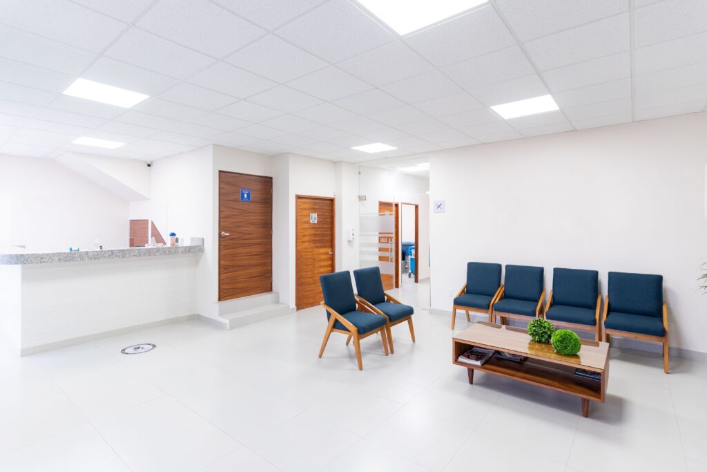 services-09 Bright and clean medical waiting room with modern seating and decor.